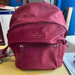 Kate spade back pack purse with matching wallet.